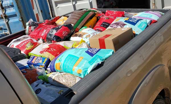 Full Truck Bed of Dog Food Bags